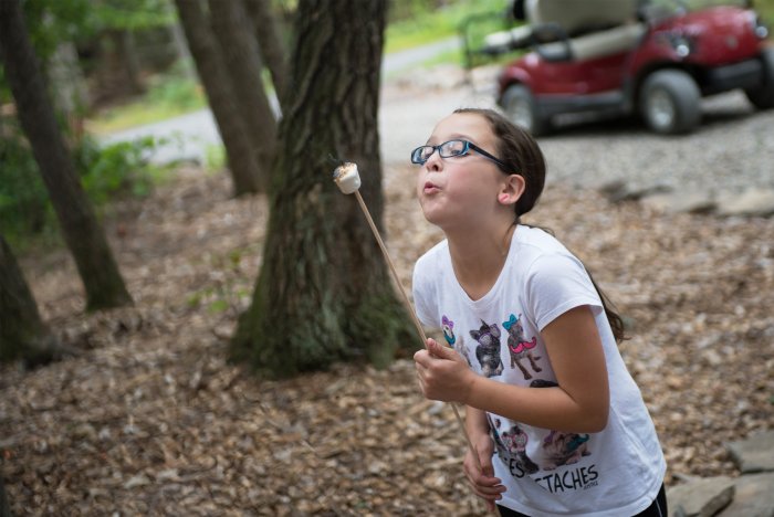 Girl roasting marshmallow