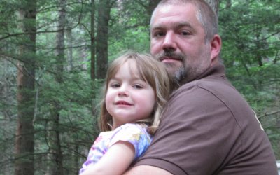Member of Rip Van Winkle Campground holding his daughter in honor of Father's Day