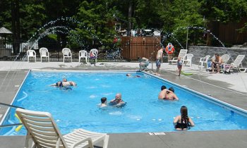 People enjoying some time in the pool at Rip Van Winkle Campgrounds